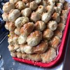 Best 6 pcs garlic knots whit side marinera in Raleigh, NC